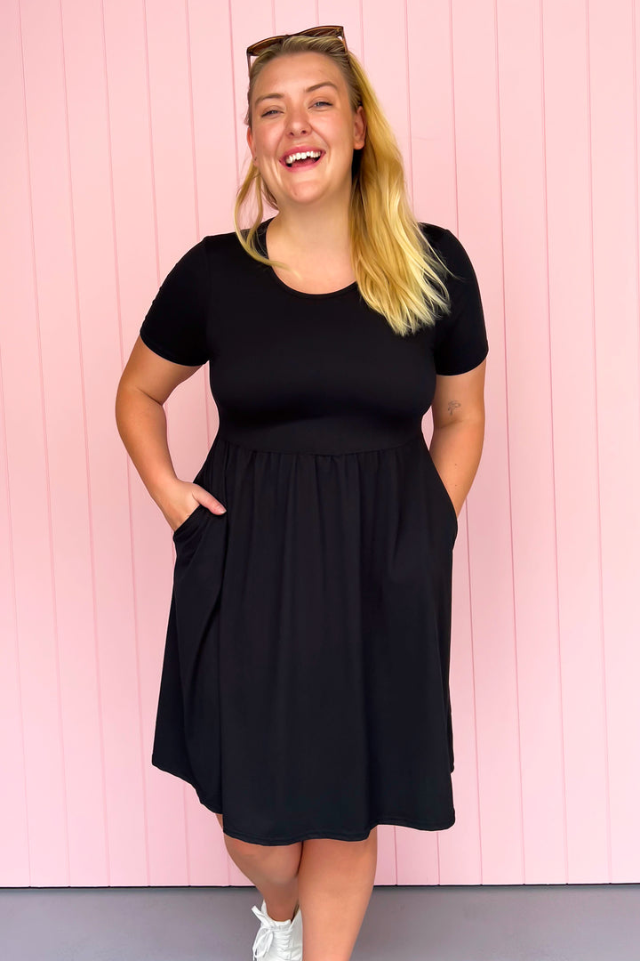 Black - Knee Length Dress - Short Sleeve - Pockets